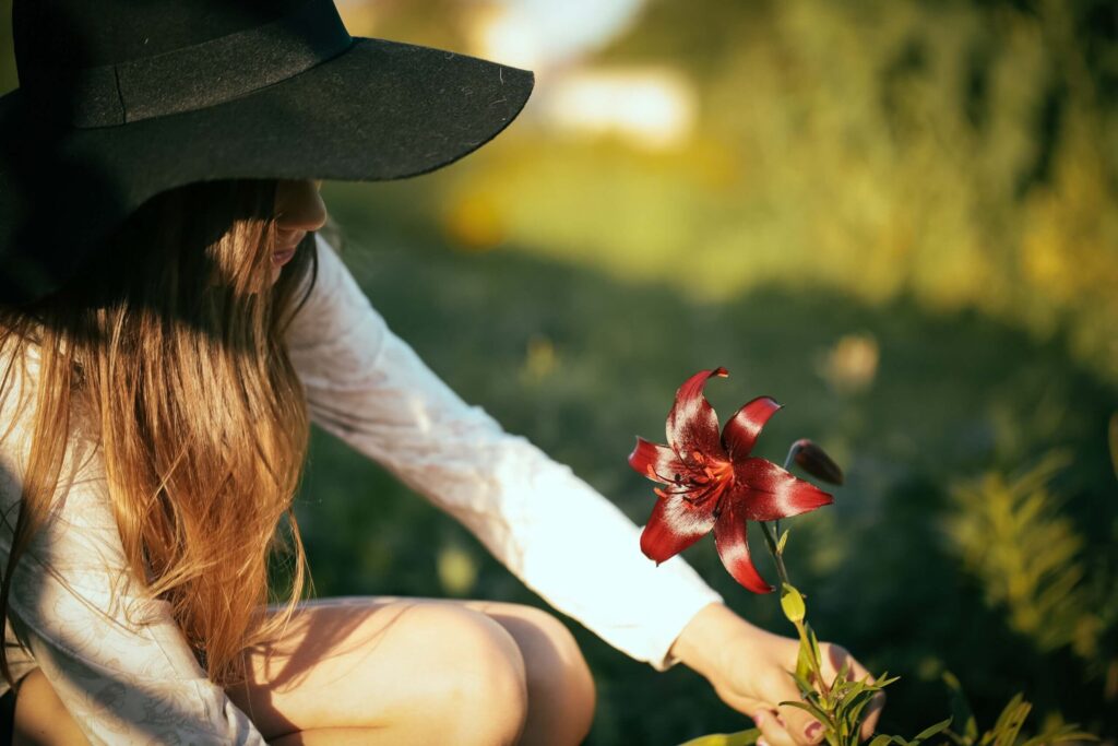 woman picking flower for meditation