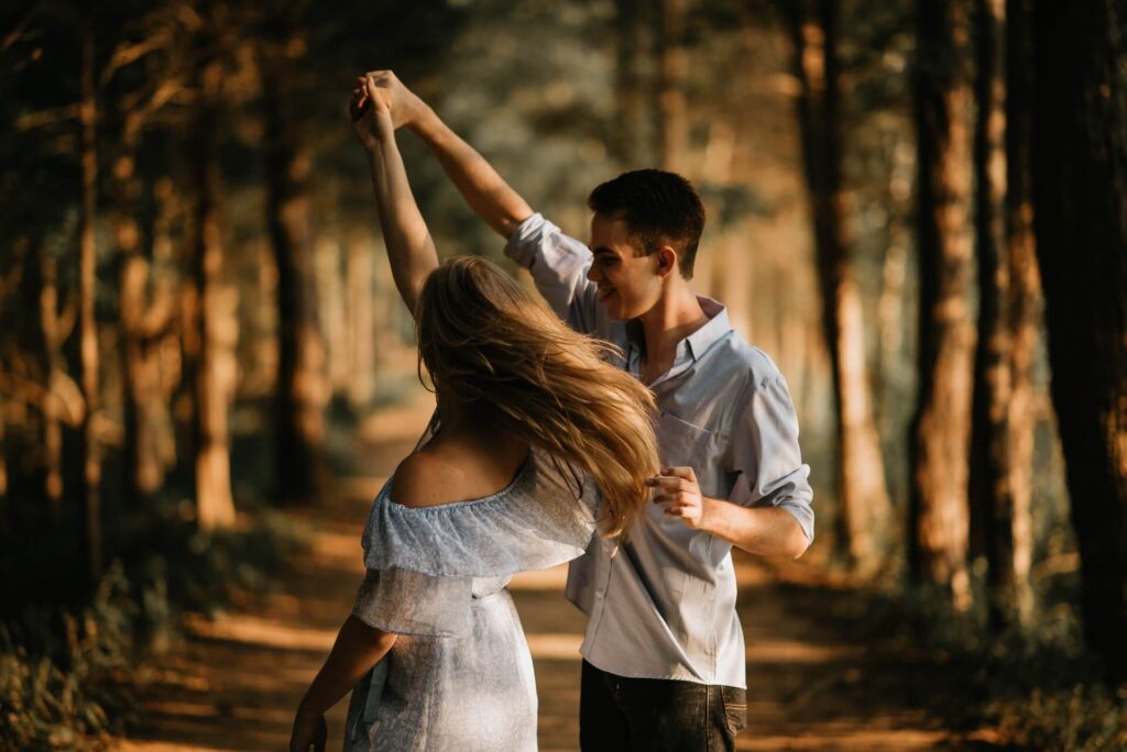 young couple dancing outdoors